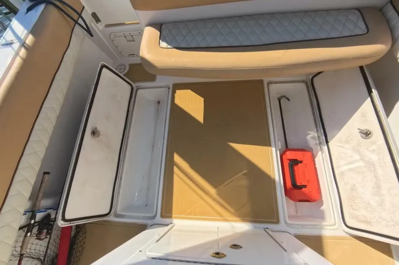 Slide: The Image of Interior of a 2020 Velocity 262cc boat with storage compartments and seating. - 18