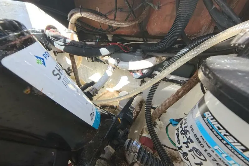 Slide: The Image of Engine compartment of a 2020 Velocity 262cc boat, showcasing wiring and fluid systems. - 26