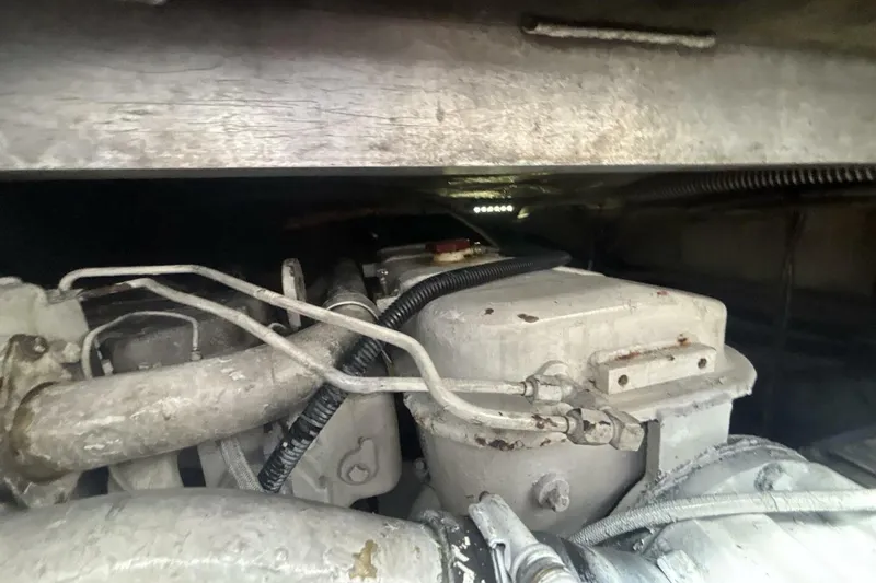Slide: The Image of Engine compartment of a 2009 Sleekcraft Kuaui boat, showing mechanical components and wiring. - 15