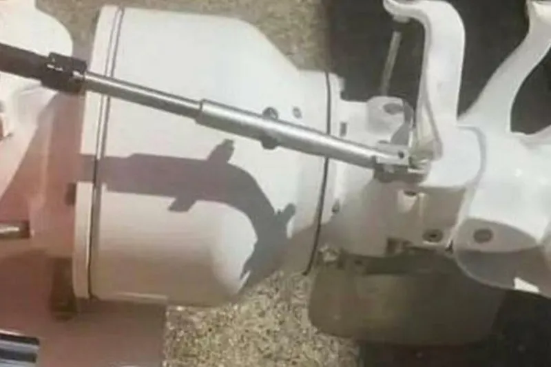 Slide: The Image of Close-up of 2009 Sleekcraft Kuaui boat engine component with steering mechanism. - 18