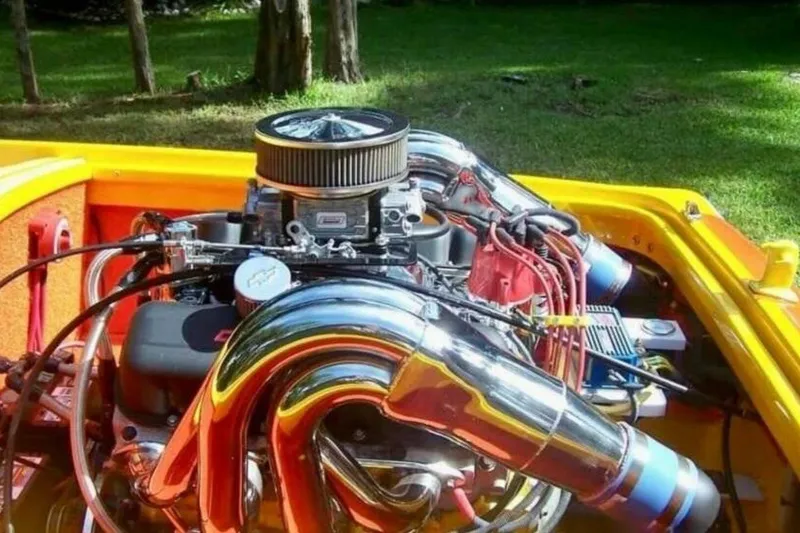 Slide: The Image of High-performance engine in a 2009 Sleekcraft Kuaui boat, featuring chrome components. - 5