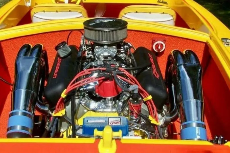 Slide: The Image of 2009 Sleekcraft Kuaui boat engine with chrome headers and vibrant red accents. - 6