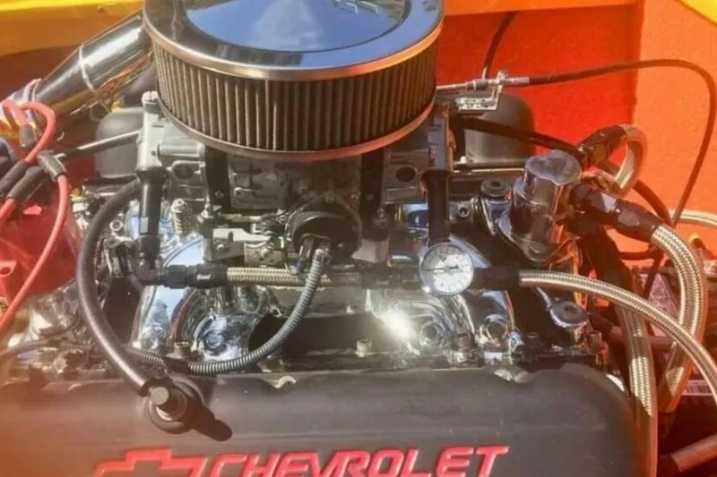Slide: The Image of Chevrolet engine in 2009 Sleekcraft Kuaui boat, featuring chrome components and red accents. - 7