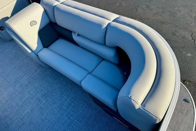 Slide: The Image of 2026 Sun Tracker Party Barge 20 DLX, featuring luxurious curved seating. - 8