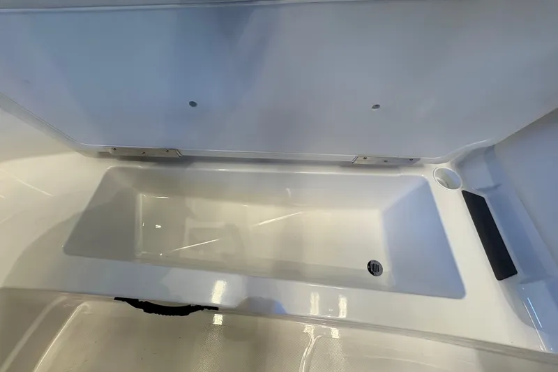 Slide: The Image of 2026 Tahoe T21 boat interior storage compartment, featuring sleek white design and ample space. - 12