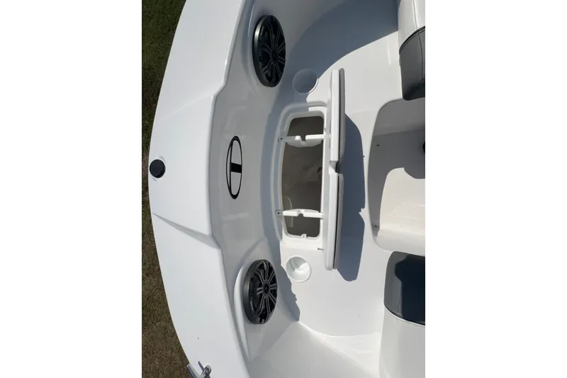 Slide: The Image of 2026 Tahoe T21 boat interior with storage compartment and speakers. - 11