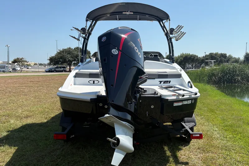 Slide: The Image of The image shows a 2026 Tahoe T21 boat with an outboard motor on a trailer. - 5