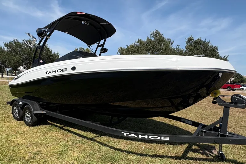 Slide: The Image of The image shows a 2026 Tahoe T21 boat on a trailer, ready for use. - 6