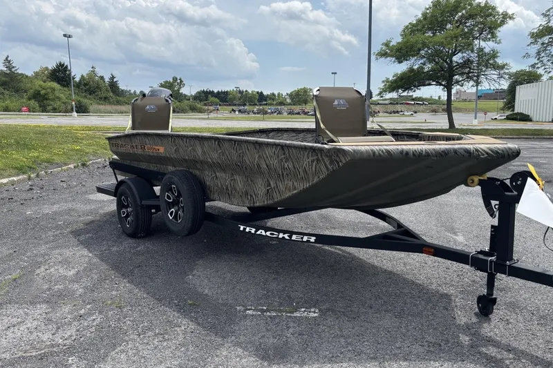 The Image of 2026 Tracker Grizzly 1756 T Marsh boat on trailer in outdoor setting. - 0