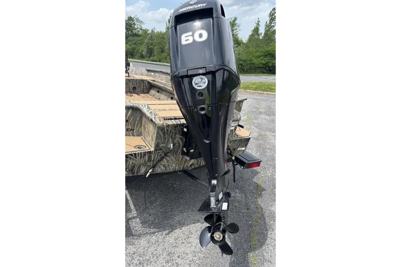 Slide: The Image of 2026 Tracker Grizzly 1756 T Marsh boat with Mercury 60 outboard motor. - 3