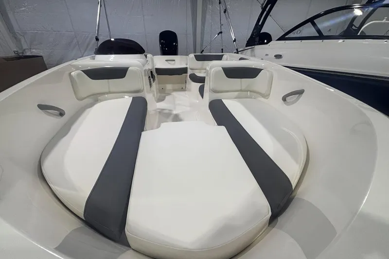 Slide: The Image of 2025 Bayliner Element E16 boat interior with cushioned seating and modern design. - 6