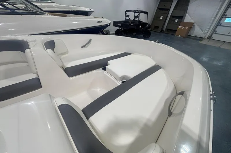 Slide: The Image of 2025 Bayliner Element E16 boat interior with sleek seating and modern design. - 8