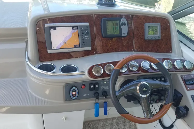 Slide: The Image of Dashboard of a 2004 Formula 370 Super Sport boat with navigation instruments. - 5