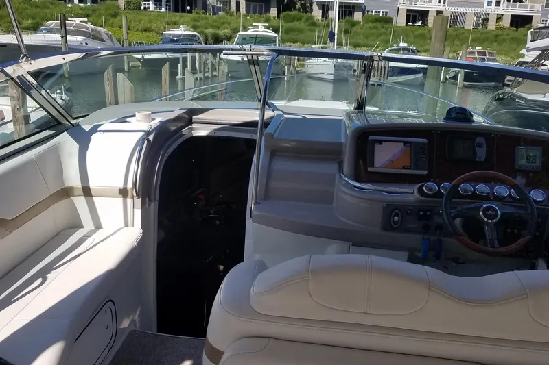 Slide: The Image of Interior view of a 2004 Formula 370 Super Sport boat cockpit with navigation equipment. - 6
