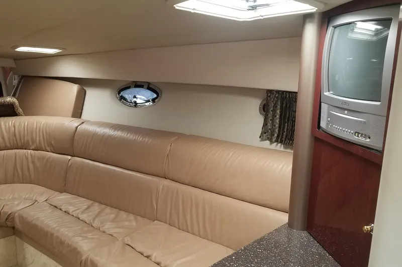 Slide: The Image of 2004 Formula 370 Super Sport cabin interior with leather seating and built-in TV. - 8