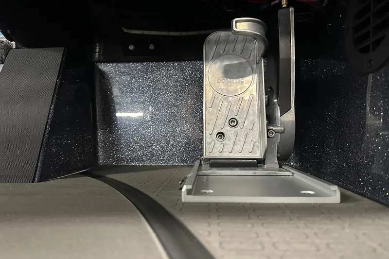 Slide: The Image of Foot pedal mechanism in 2026 Triton 20XP boat interior, featuring metallic and textured surfaces. - 14