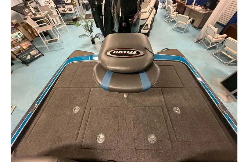 Slide: The Image of 2026 Triton 20XP boat interior with seating and storage compartments. - 15