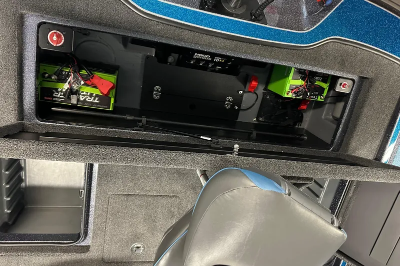 Slide: The Image of Interior view of 2026 Triton 20XP boat showing battery compartment and seating. - 18