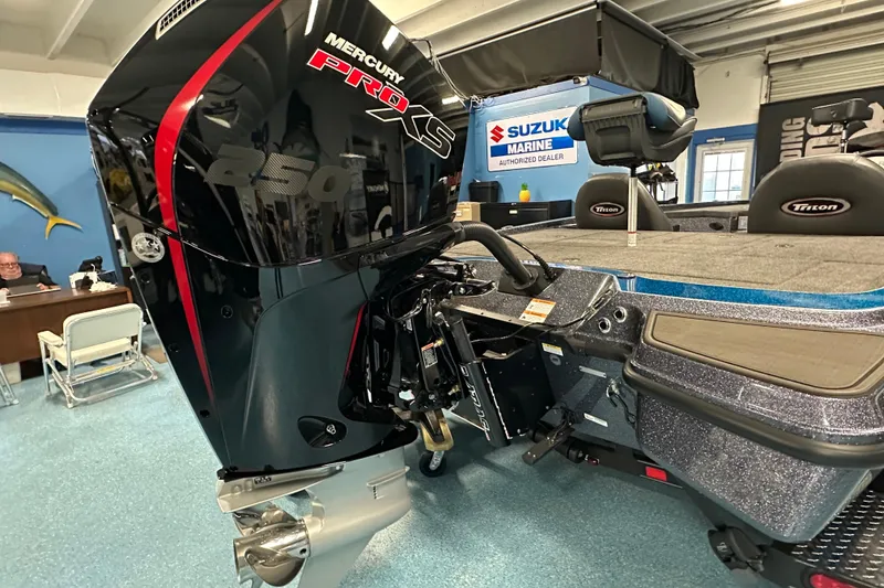 Slide: The Image of 2026 Triton 20XP boat with Mercury Pro XS 250 engine in showroom. - 22