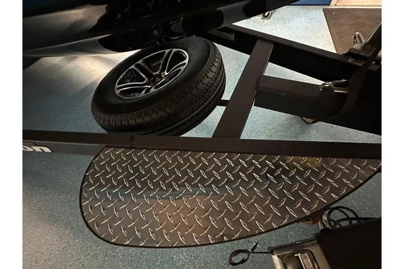 Slide: The Image of Triton 20XP 2026 trailer with diamond plate step and spare tire. - 24