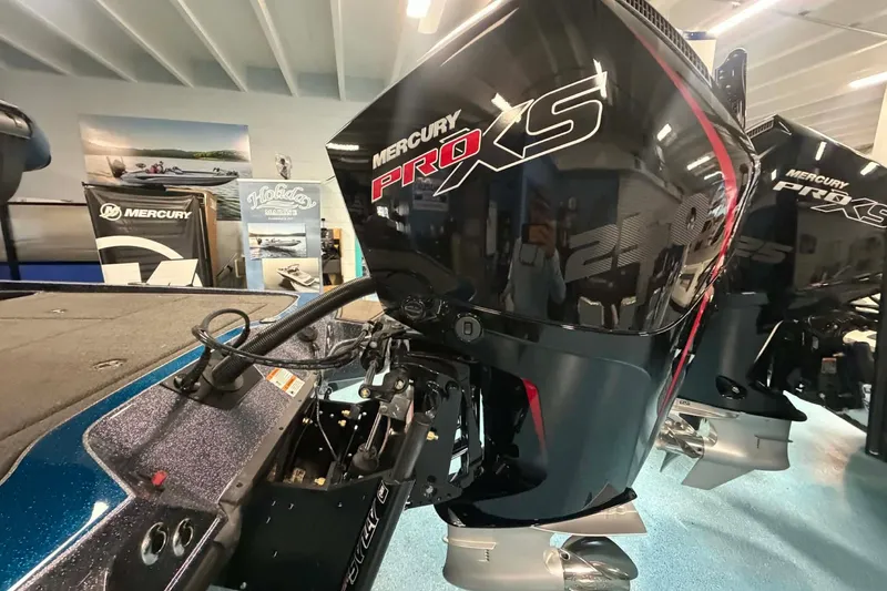 Slide: The Image of 2026 Triton 20XP boat with Mercury Pro XS engine in showroom display. - 7