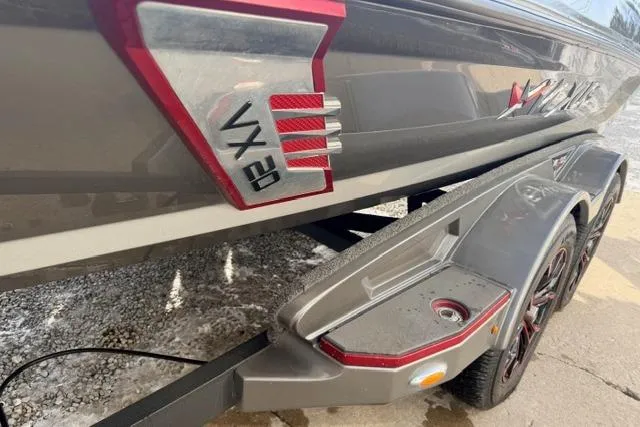 Slide: The Image of 2020 Vexus VX20 boat on trailer, showcasing sleek design and branding. - 10