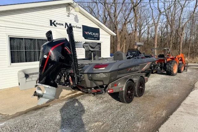 Slide: The Image of 2020 Vexus VX20 boat at Knox Marine, parked with a tractor nearby. - 3