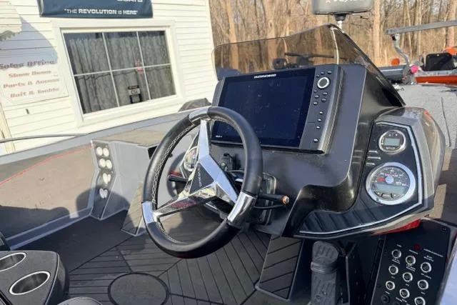 Slide: The Image of 2020 Vexus VX20 boat dashboard with steering wheel and navigation system. - 5