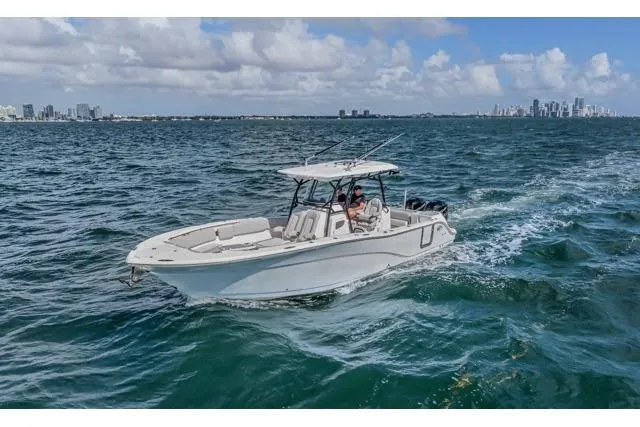 The Image of 2022 Sea Fox 328 Commander cruising on open water with city skyline in background. - 0
