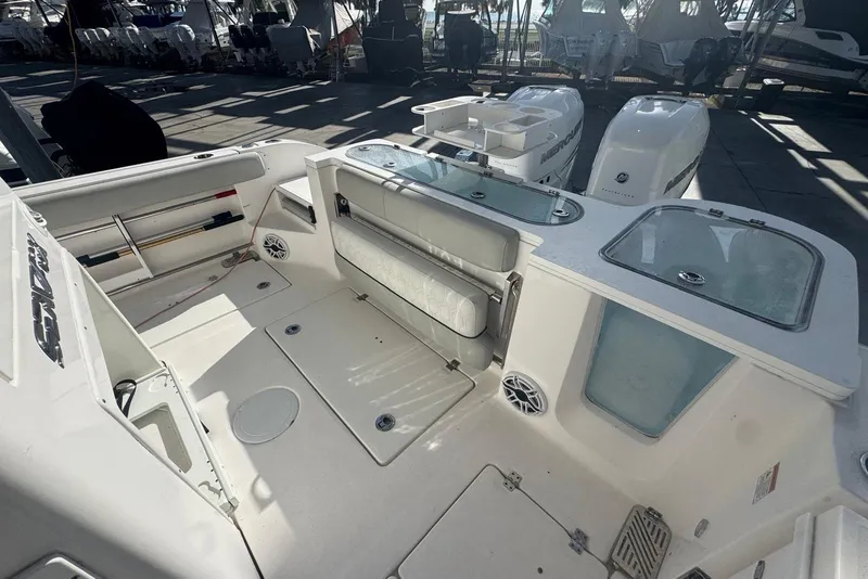 Slide: The Image of 2022 Sea Fox 328 Commander boat interior with seating and storage compartments. - 4