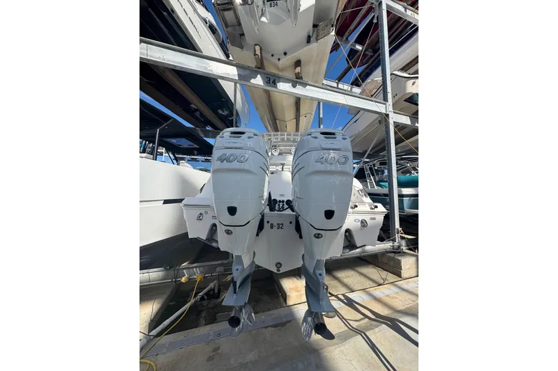Slide: The Image of 2022 Sea Fox 328 Commander with twin 400 horsepower engines in a boatyard. - 5