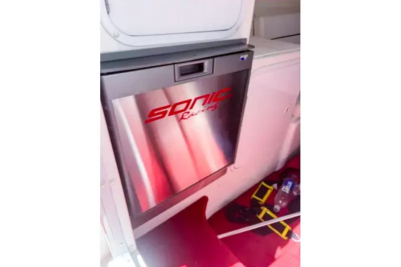 Slide: The Image of Stainless steel fridge in 2001 Sonic 31 SS boat interior. - 9