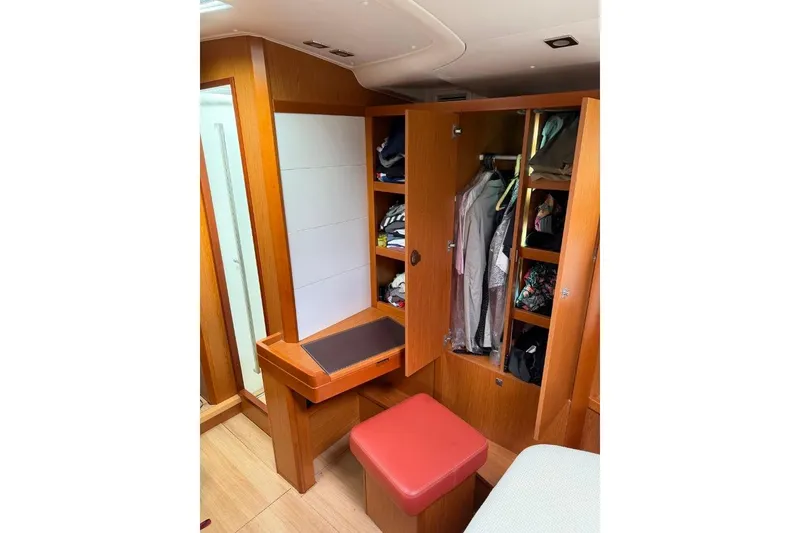 Slide: The Image of Luxurious 2015 Beneteau Sense 55 yacht with spacious outdoor seating and scenic water view. - 21