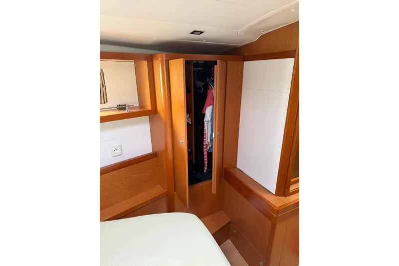 Slide: The Image of Spacious deck of 2015 Beneteau Sense 55 yacht with comfortable seating and scenic water view. - 22