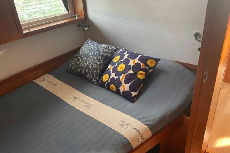 Slide: The Image of 2015 Beneteau Sense 55 yacht in dry dock, showcasing sleek hull design. - 29