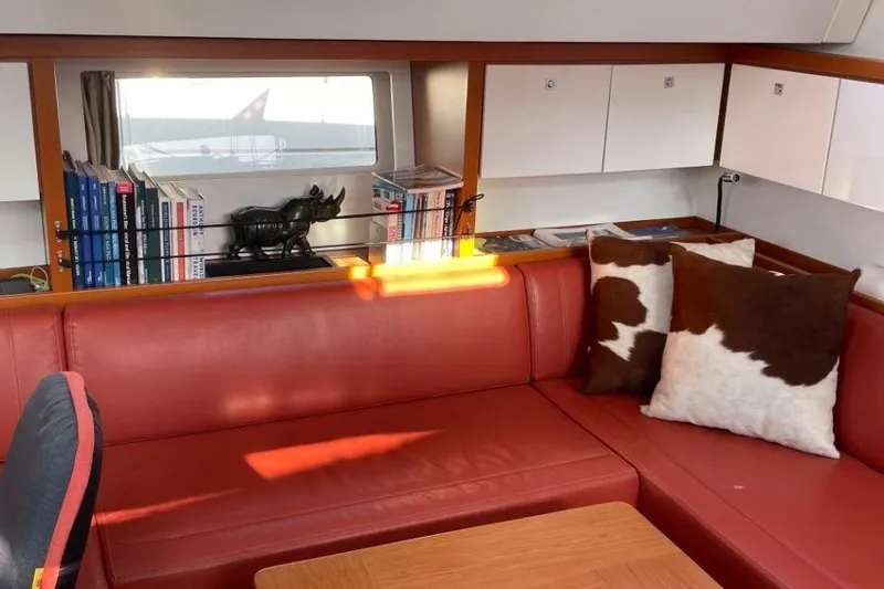 Slide: The Image of Luxurious cabin interior of 2015 Beneteau Sense 55 yacht with stylish bedding and window view. - 32