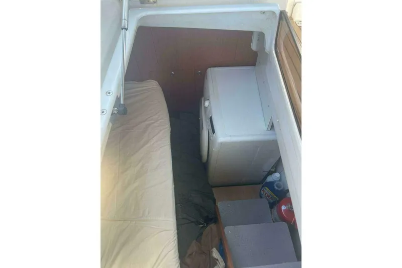 Slide: The Image of Interior of 2015 Beneteau Sense 55 yacht with washing machine and storage area. - 54
