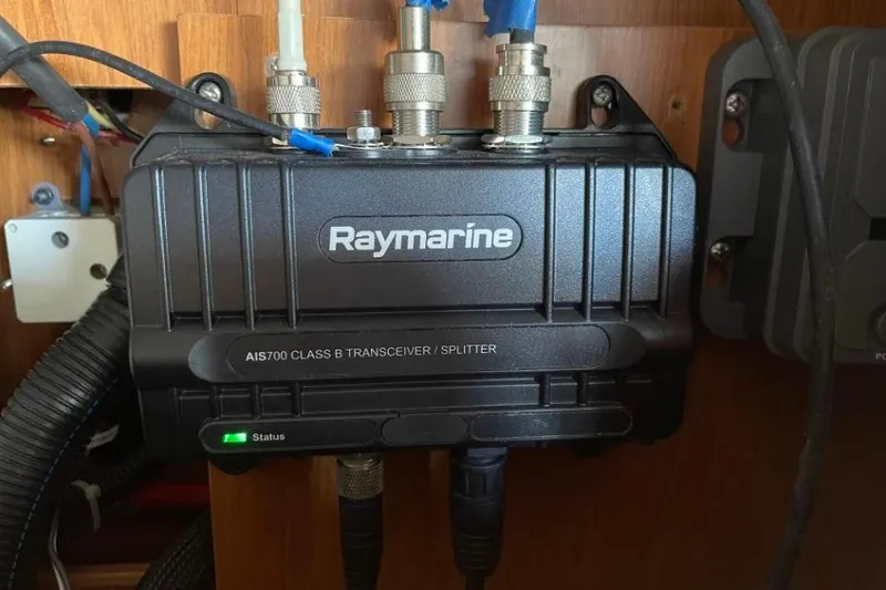 Slide: The Image of Raymarine AIS700 transceiver installed on a 2015 Beneteau Sense 55 yacht. - 58