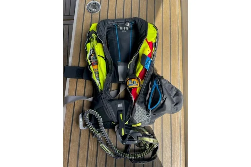 Slide: The Image of Safety gear on Beneteau Sense 55 yacht, 2015 model, featuring a Vito life jacket. - 59