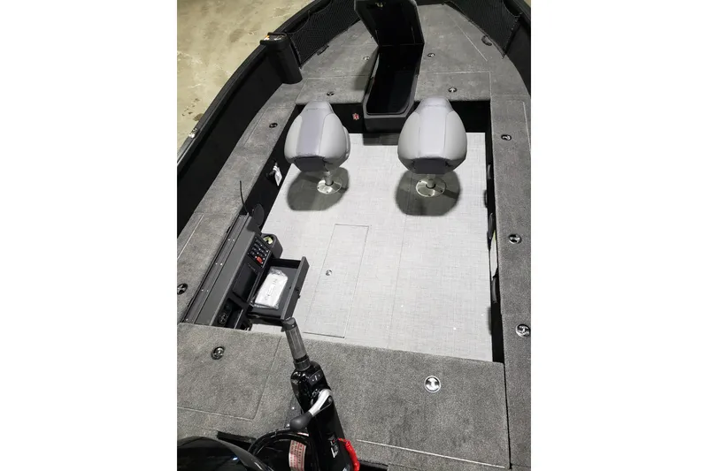 Slide: The Image of 2026 Alumacraft Competitor 185X Tiller interior with two seats and storage compartments. - 12