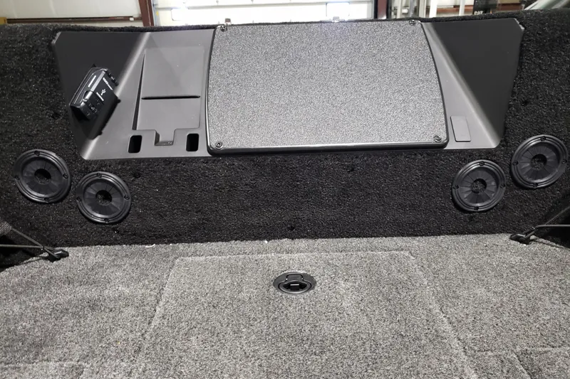 Slide: The Image of Interior of 2026 Alumacraft Competitor 185X Tiller boat with speakers and storage. - 16