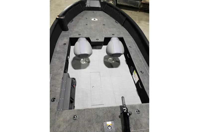 Slide: The Image of 2026 Alumacraft Competitor 185X Tiller boat interior with dual seats and spacious deck. - 4