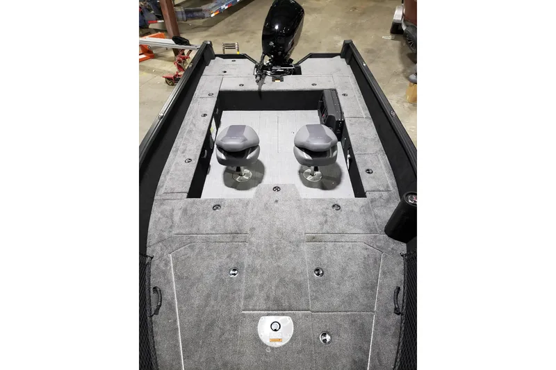 Slide: The Image of 2026 Alumacraft Competitor 185X Tiller boat interior with dual seats and carpeted deck. - 5