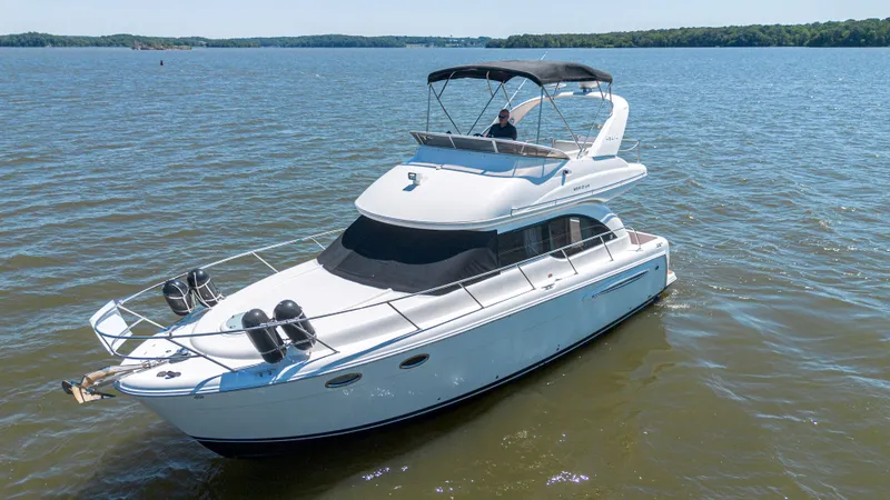 Slide: The Image of 2005 Meridian 341 Sedan Yacht on calm waters. - 23