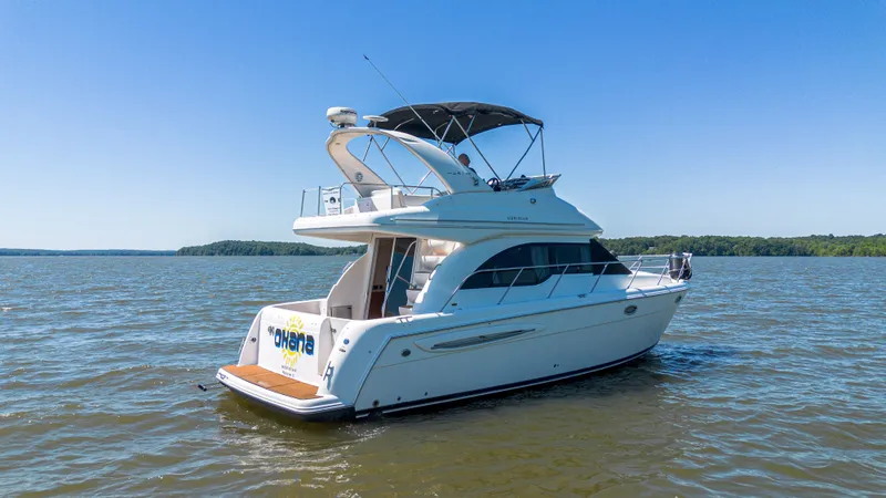 Slide: The Image of 2005 Meridian 341 Sedan on calm waters under clear sky. - 28