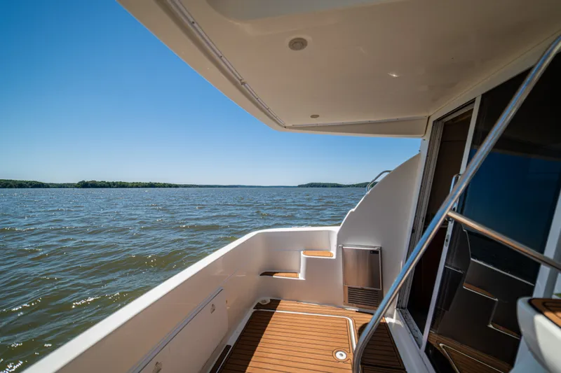 Slide: The Image of Deck of a 2005 Meridian 341 Sedan overlooking the water. - 40
