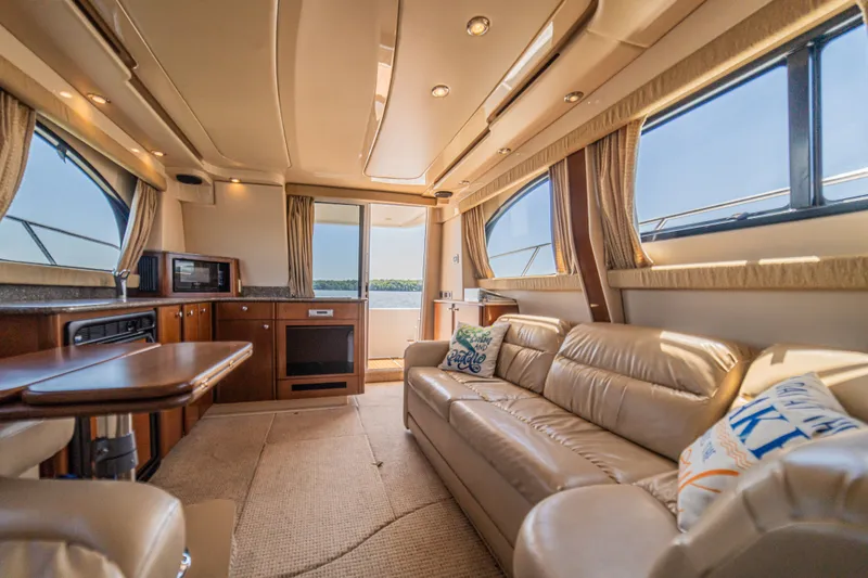 Slide: The Image of Interior of a 2005 Meridian 341 Sedan yacht with leather sofa and kitchen. - 45
