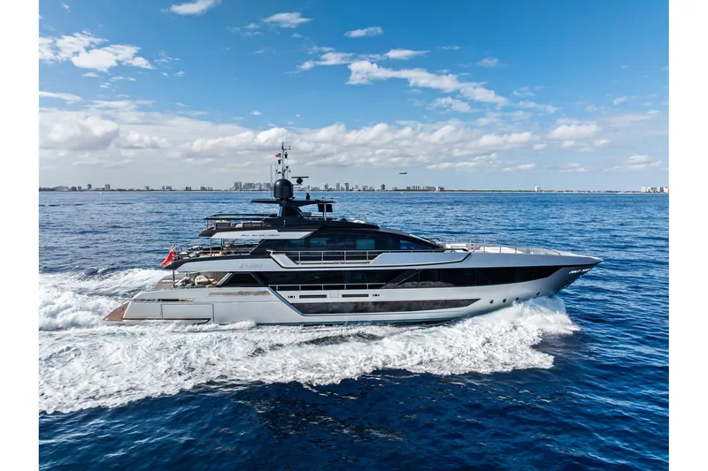 The Image of 2024 Riva 130' Bellissima yacht cruising on open sea under blue sky. - 0