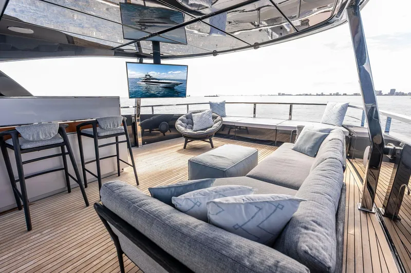 Slide: The Image of Luxurious deck of 2024 Riva 130' Bellissima yacht with modern seating and ocean view. - 10