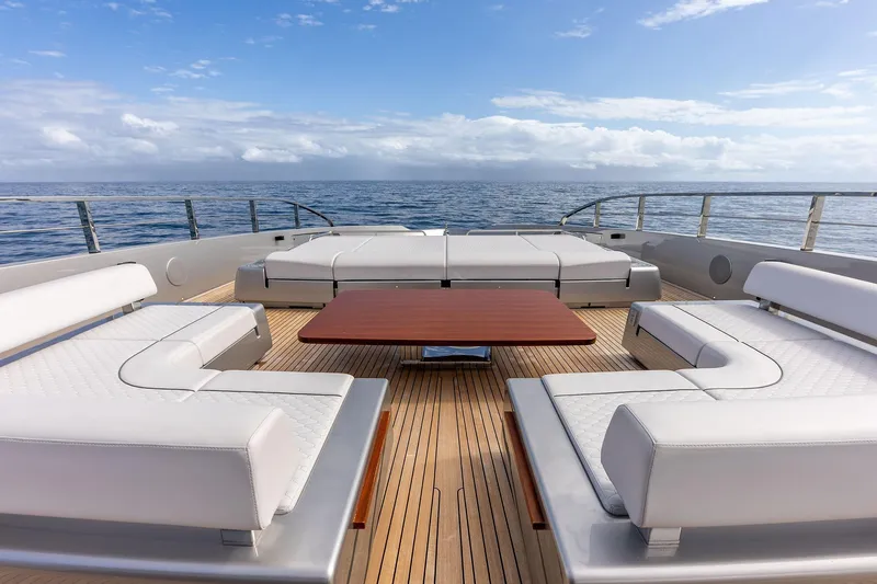 Slide: The Image of Luxurious deck of 2024 Riva 130' Bellissima yacht with elegant seating and ocean view. - 12
